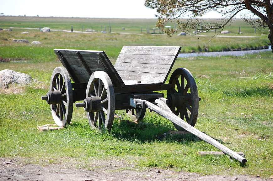 Vintage wooden wagon in grassy field