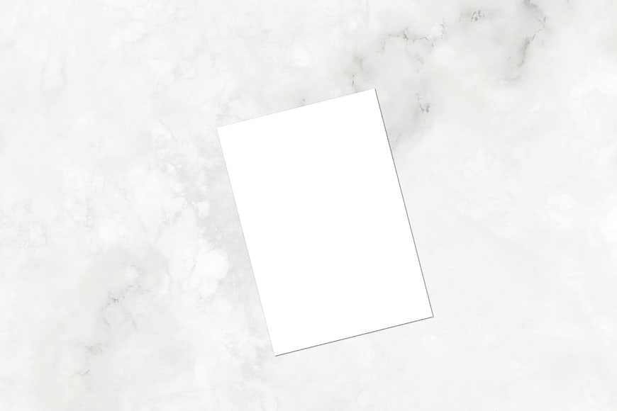 Blank White Paper Mockup on White Marble Surface