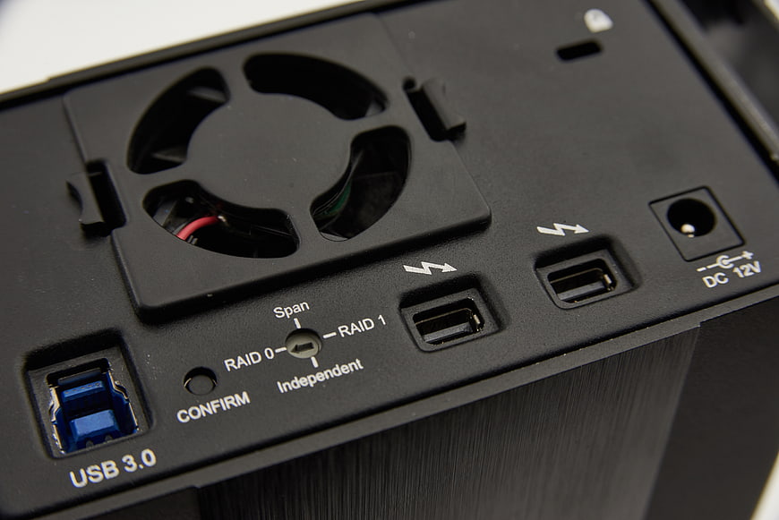 Close-up of black external hard drive enclosure with USB 3.0 and RAID settings
