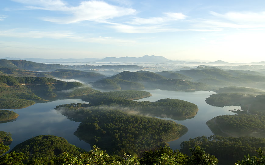 Misty Morning Landscape of Lake and Forested Hills in Dalat Vietnam
