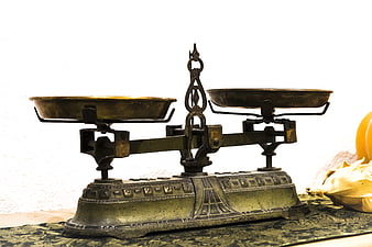 Antique Brass Balance Scale on Patterned Fabric