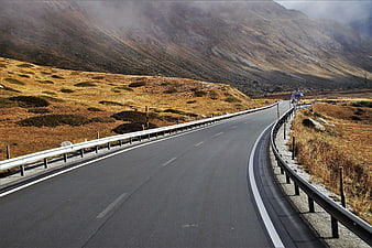 Winding Mountain Road Through Alpine Landscape