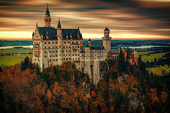 Neuschwanstein Castle in Bavaria at Sunset with Autumn Foliage