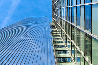 Low Angle View of Modern Glass Skyscrapers Against Blue Sky