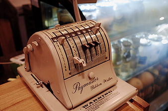 Vintage Paymaster Ribbon Writer Cash Register on Wooden Counter