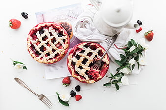 Overhead view of homemade berry pies with lattice crust