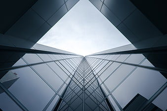 Low angle view of modern glass skyscraper architecture