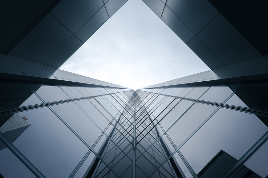 Low angle view of modern glass skyscraper architecture