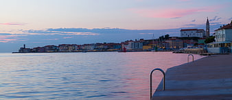 Panoramic sunset view of Rovinj, Croatia from the harbor pier
