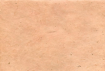 Textured beige handmade paper background with natural fibers