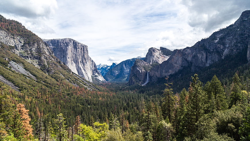 Majestic Yosemite Valley Landscape with Waterfall and Granite Cliffs