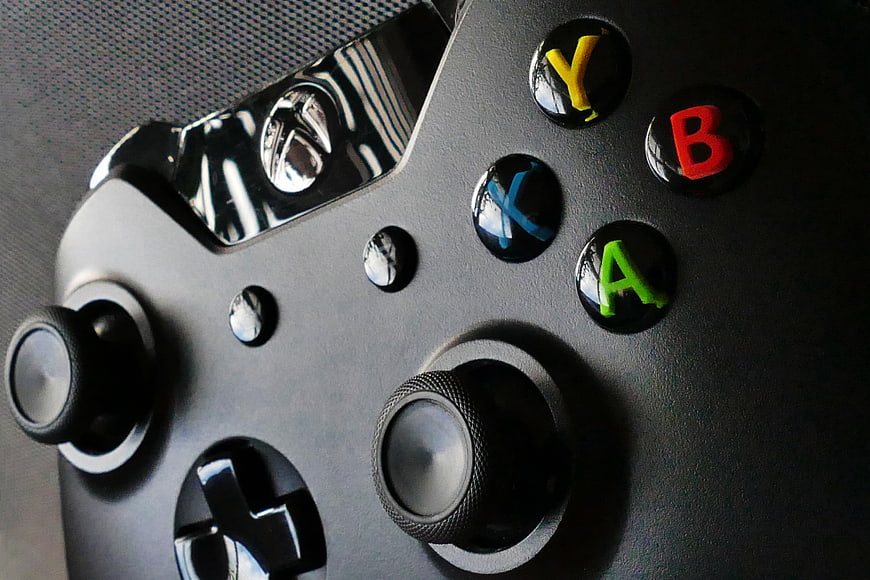 Close-up of Black Xbox Controller with Colorful Buttons