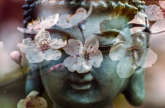 Serene Buddha Statue with Overlapping Cherry Blossoms