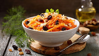 Healthy Carrot Raisin Walnut Salad in White Bowl