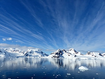 Snowy Mountains and Icebergs in Antarctica Paradise Bay