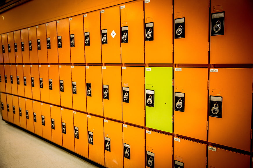 Unique Green Locker in a Row of Orange Lockers