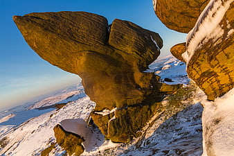 Dramatic sandstone rock formation in winter snow