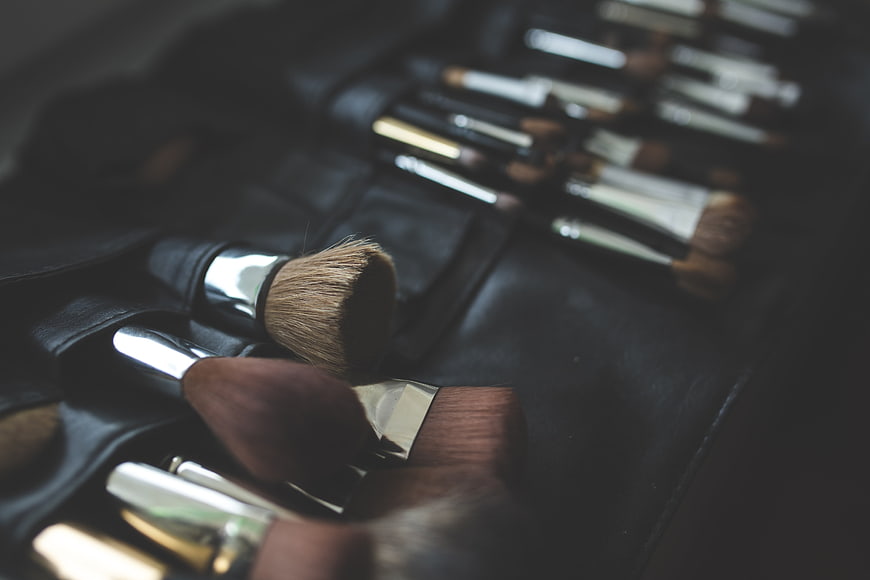 Professional makeup brushes in black leather case