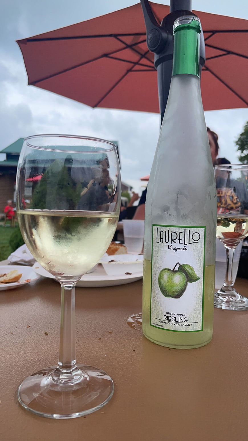 Chilled Green Apple Riesling Wine Bottle and Glass Outdoors