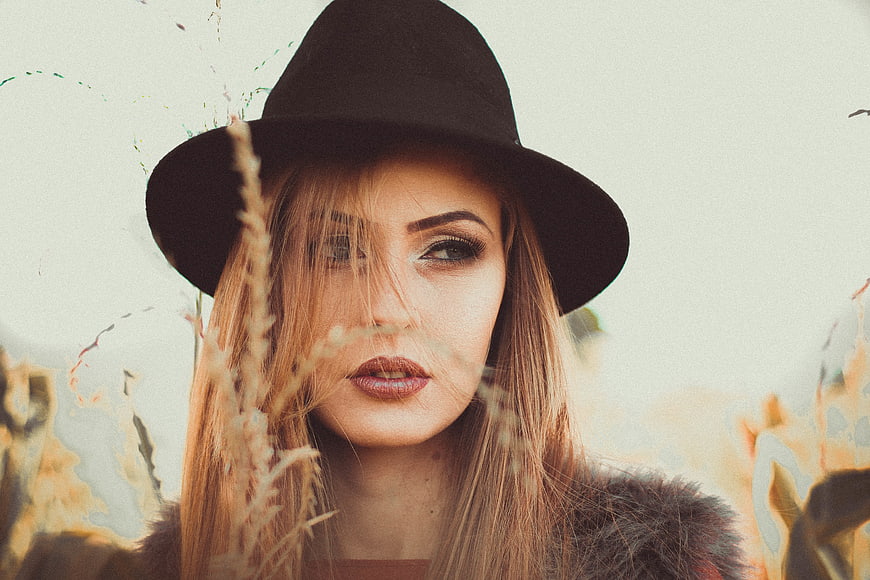 Woman in Black Hat with Vintage Film Grain Effect