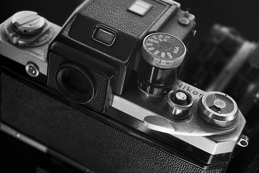 Close-up of vintage Nikon SLR camera in black and white