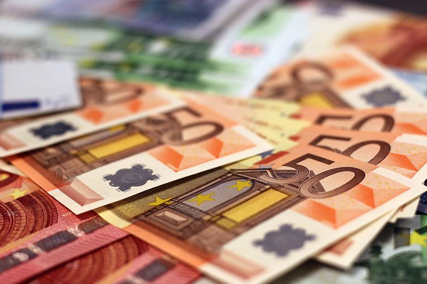 Close-up of scattered Euro banknotes with shallow depth of field
