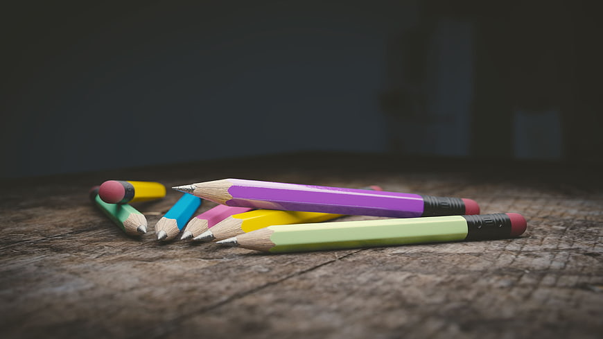 Colorful Pencils on Rustic Wooden Table