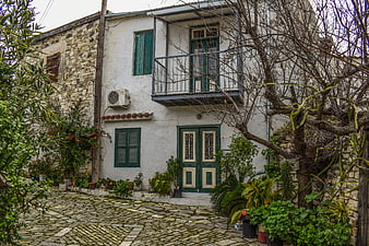 Traditional White House with Green Shutters in Cyprus