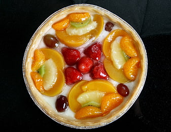 Fresh Fruit Tart With Cream, Strawberries, Peaches, Kiwi, And Oranges