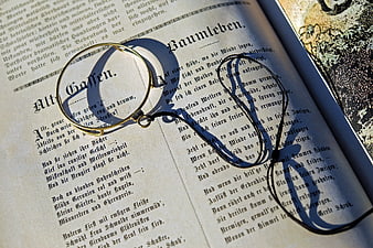 Vintage Magnifying Glass on Old German Poetry Book