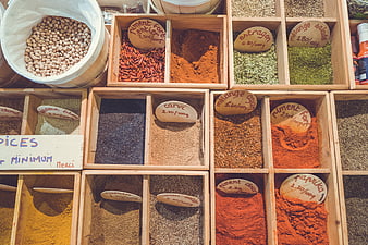 Top View of Assorted Spices in Wooden Market Boxes