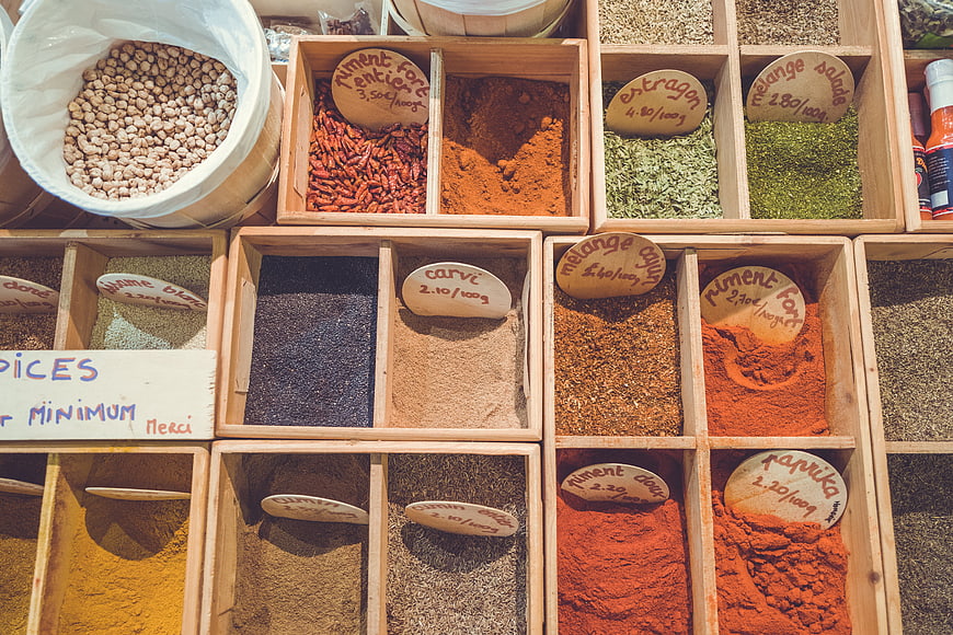 Top View of Assorted Spices in Wooden Market Boxes