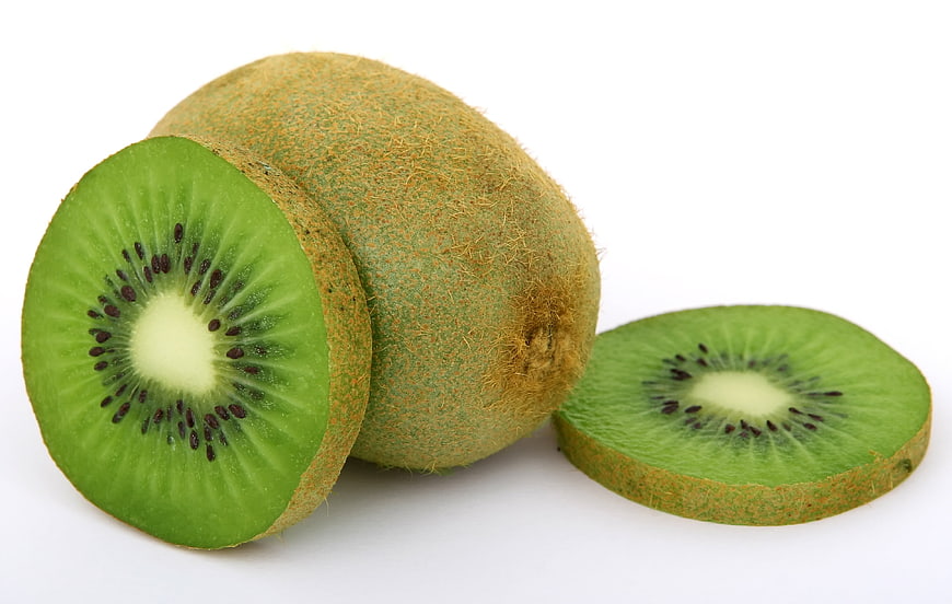 Fresh Green Kiwi Fruit Sliced on White Background