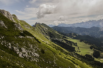 Panoramic Alpine Mountain Landscape with Green Valleys