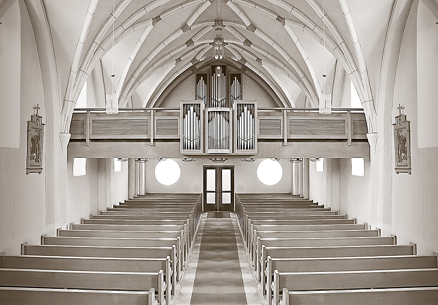 Symmetrical Sepia Church Interior with Pipe Organ and Pews