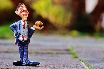 Caricature Businessman Figurine Holding Euro Coin On Outdoor Path