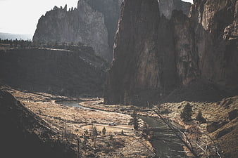 Dramatic Canyon Landscape with River and Rocky Cliffs