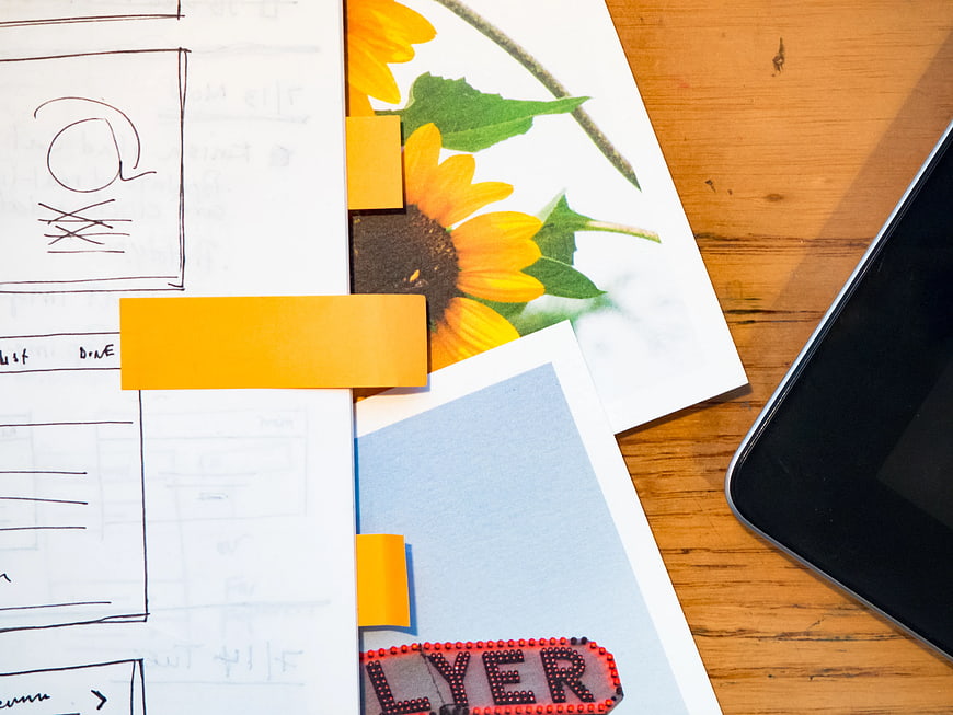 Creative Workspace with Sketchbook, Sunflower Photo, and Smartphone