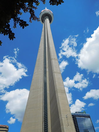 Low angle view of CN Tower against blue sky