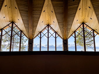 Modern wooden interior with panoramic mountain lake view