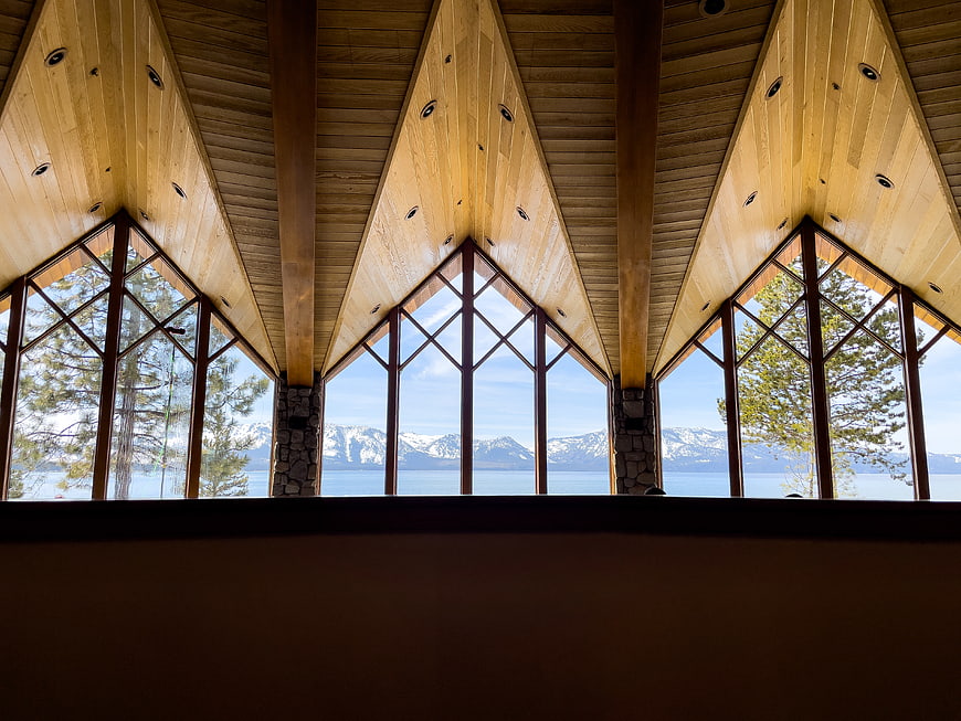 Modern wooden interior with panoramic mountain lake view