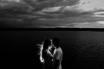 Silhouette of Romantic Couple by Lake at Dusk