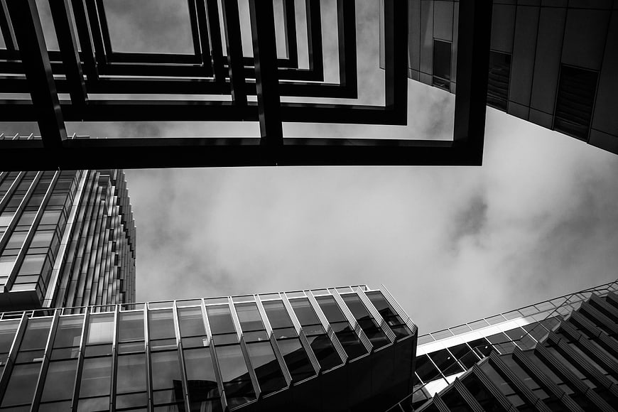 Black and White Modern Architecture Looking Up at Cloudy Sky