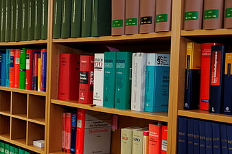 Colorful Law Books on Wooden Library Shelves