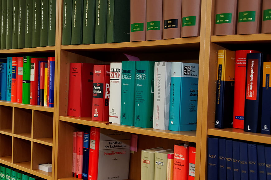 Colorful Law Books on Wooden Library Shelves