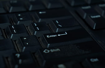 Close-up of black computer keyboard enter key