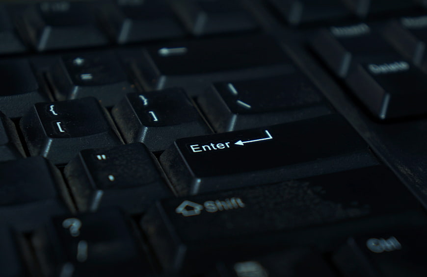 Close-up of black computer keyboard enter key