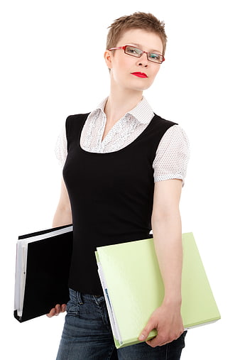 Professional woman with short hair holding office folders
