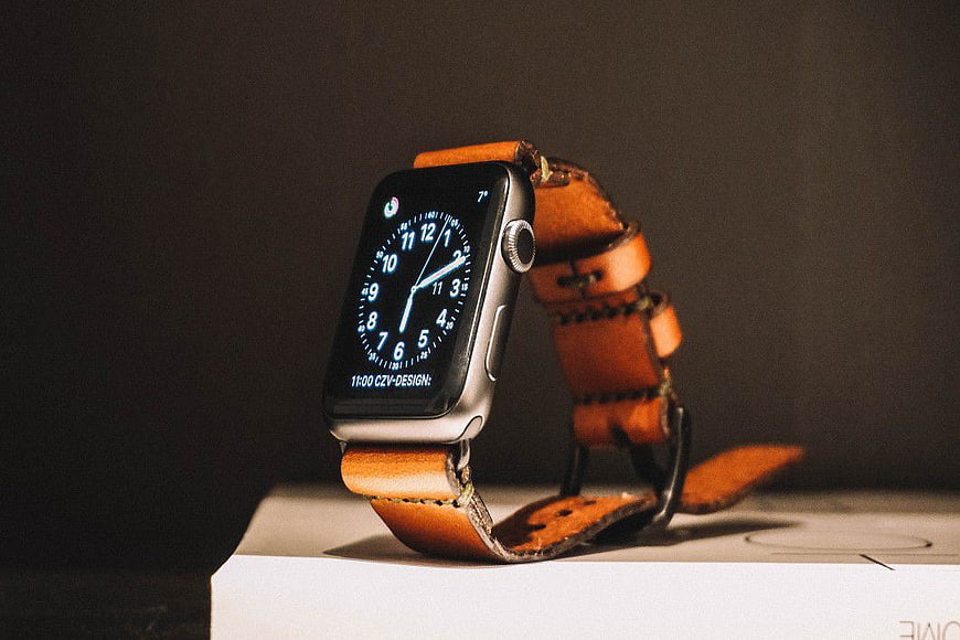 Apple Watch with Brown Leather Strap on White Box
