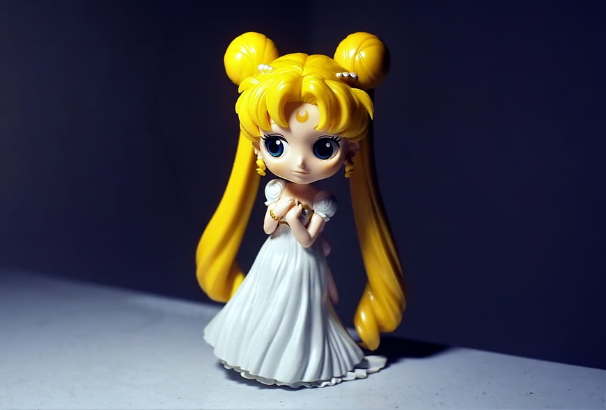 Sailor Moon Chibi Figure in White Dress on Dark Background